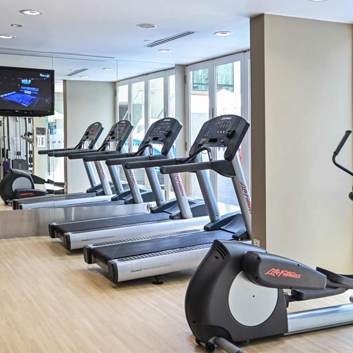 Treadmills and ellipticals in the Park Regis Singapore fitness center