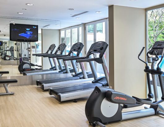 Treadmills and ellipticals in the Park Regis Singapore fitness center